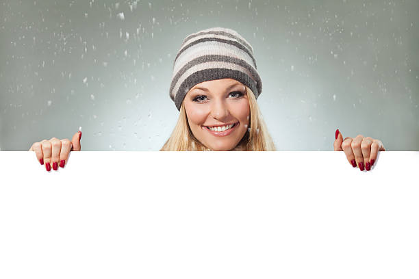 istock Woman holding blank banner 467915209