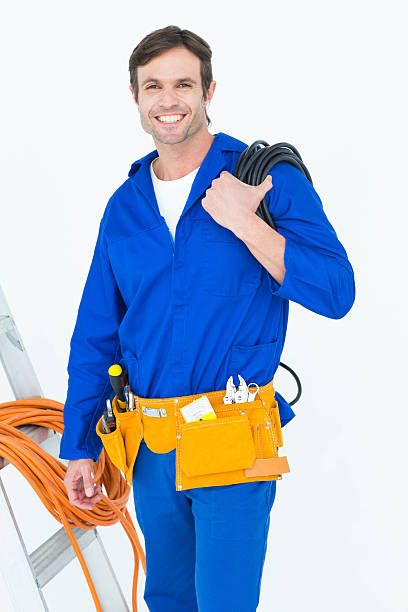 istock Happy electrician with wires over white background 467916176