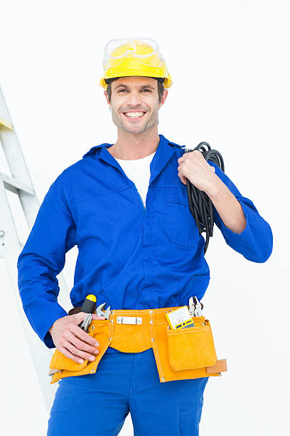 istock Happy electrician with wires against white background 467916212