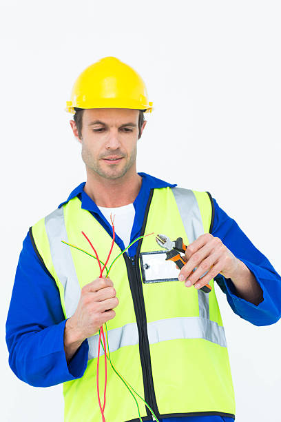 istock Electrician cutting wire with pliers 467916334