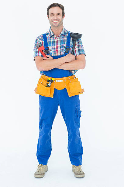 istock Confident plumber holding monkey wrench and plunger 467916702
