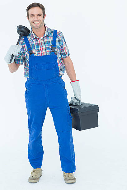 istock Portrait of plumber holding plunger and tool box 467916712