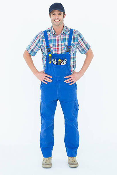 istock Portrait of confident plumber with hands on hip 467916776