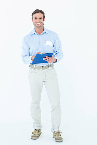 istock Confident businessman holding clipboard 467916804