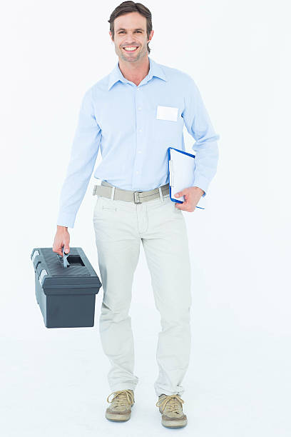 istock Happy supervisor carrying tool box and clipboard 467916826