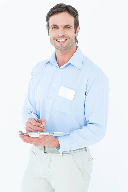 istock Portrait of confident supervisor writing notes on clipboard 467916832