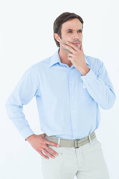 istock Businessman with hand on chin looking away 467916846