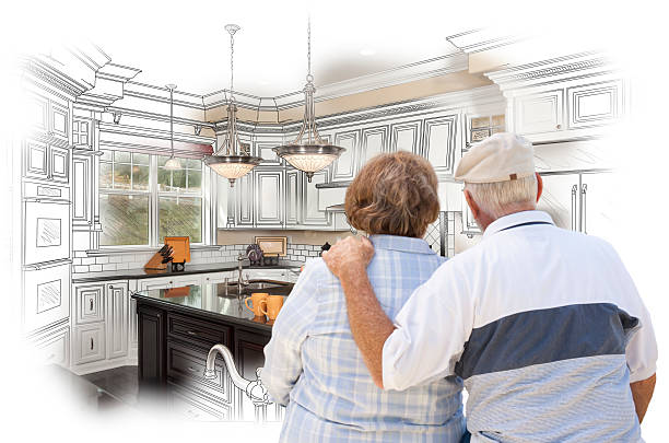 istock Senior Couple Looking Over Custom Kitchen Design Drawing and Pho 467917078