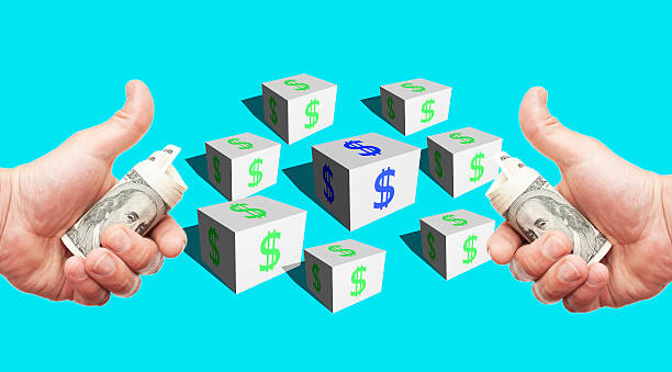 istock Cubes with a dollar sign  and hands with currency 467917412
