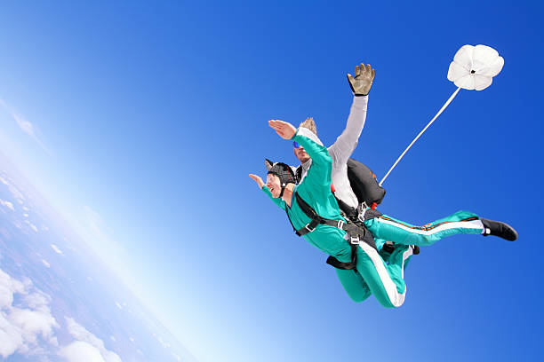 in tandem skydiving - skydiving parachuting extreme sports airplane foto e immagini stock