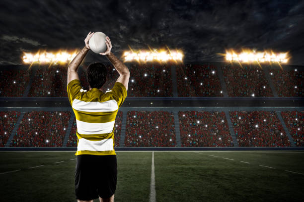istock A rugby player holding the ball over his head 467918728