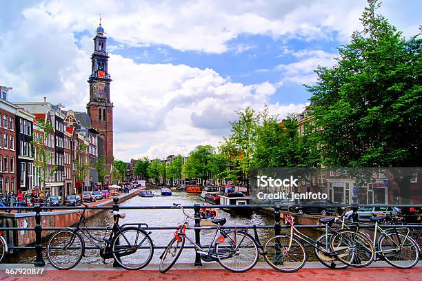 Amsterdam Canal Scene With Church And Bicycles Stock Photo - Download Image Now - Amsterdam, Bell Tower - Tower, Bicycle