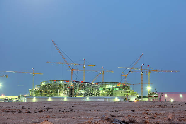 Construction of a new stadium in Qatar Construction of a new stadium in the desert of Qatar, Middle East qatar photos stock pictures, royalty-free photos & images