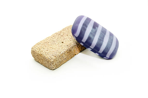Hygiene products - bacterial soap and pumice on a white background