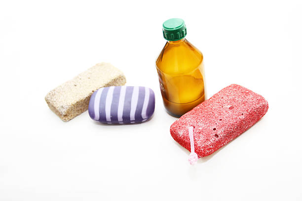 Different means of hygiene - pumice, soap and lotion on a white background