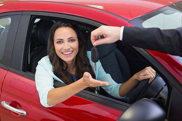istock Businessman holding car keys by his fingertips 467922136