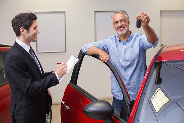 istock Smiling customer showing his new key 467922284