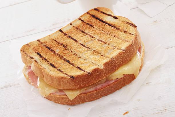 istock toasted cheese and ham sandwich with coffee 467923238