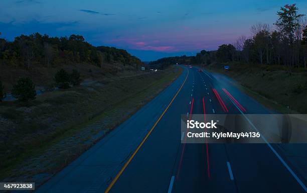 Highway At Dusk With Tail Light Trails Stock Photo - Download Image Now - 2015, Asphalt, Car