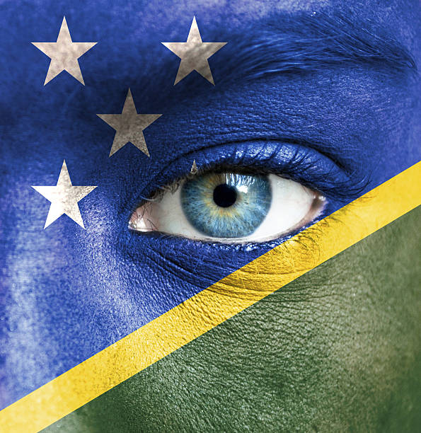 istock Human face painted with flag of Solomon Islands 467924267