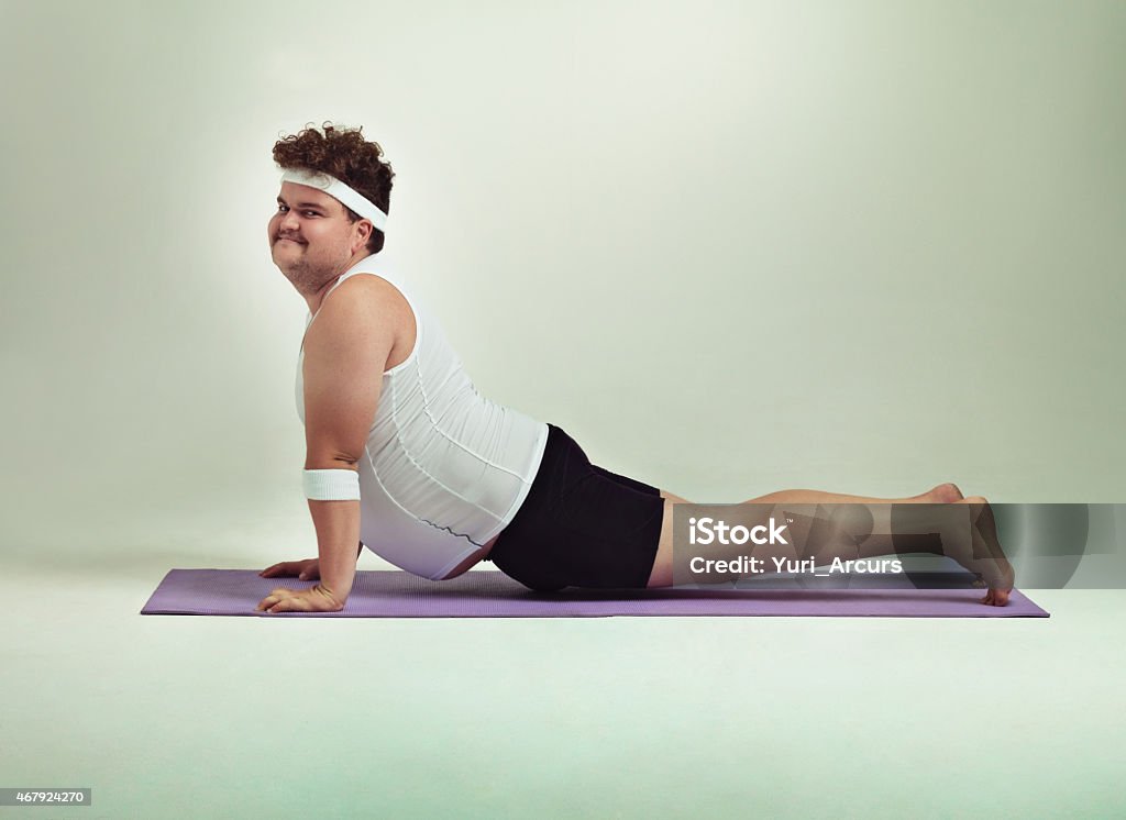 This upward facing dog pose is great Shot of an overweight man doing yoga poseshttp://195.154.178.81/DATA/istock_collage/0/shoots/783846.jpg Humor Stock Photo