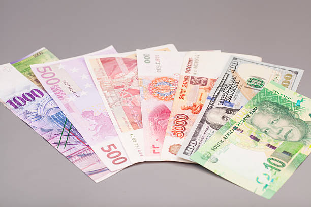 istock International currencies isolated on gray backgrond 467924702