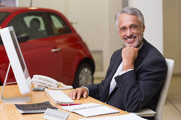istock Cheerful businessman working at his desk 467925268