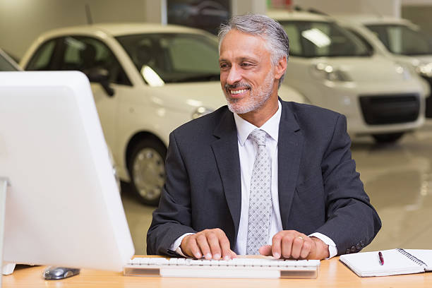 istock Cheerful businessman working at his desk 467925500
