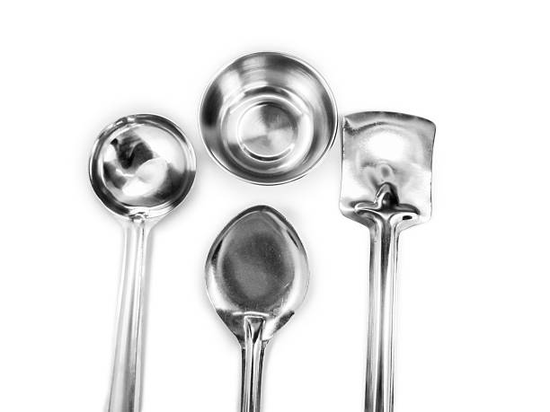 istock Stainless steel cooking utensils arranged and isolated 467925550