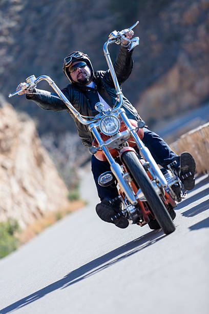 istock riding a chopper motorbike 467925704