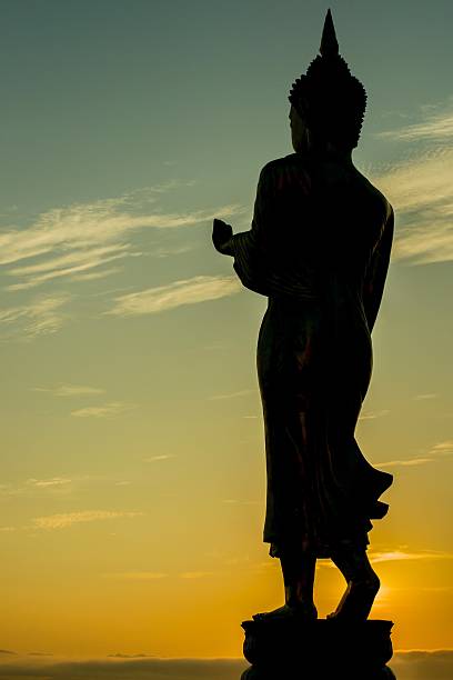 istock Silhouette of Buddha statue against a sunset 467927037