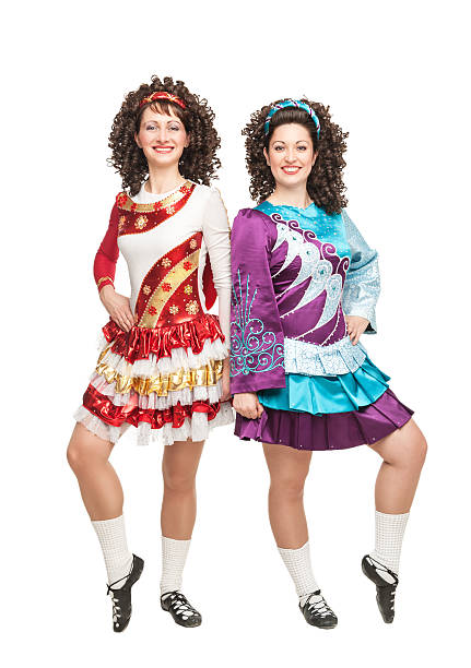 istock Two young women in Irish dance dresses posing isolated 467927131