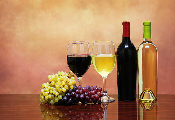 istock Bottles of Red and White Wine with Fresh Grapes 467927424
