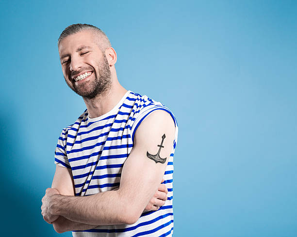 Happy Bearded Sailor Man Wearing Striped Tshirt Stock Photo - Download  Image Now - Tattoo, Bicep, Men - iStock