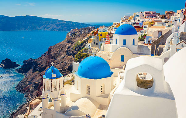 istock Santorini blue dome churches and chimney, Greece 467928460