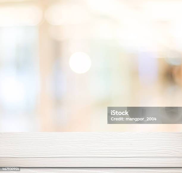 Empty White Table And Blurred Store Bokeh Background Stock Photo - Download Image Now