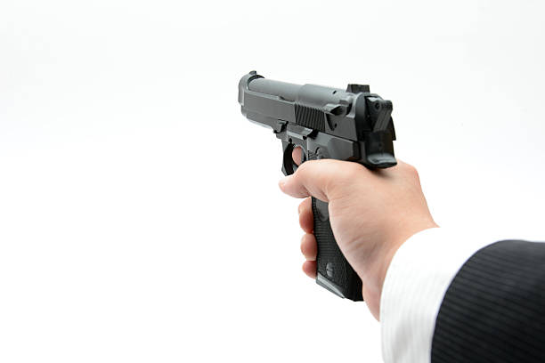 istock Gun in male hand 467933762