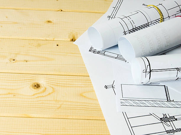 istock Many drawings for building on a wooden background 467934672