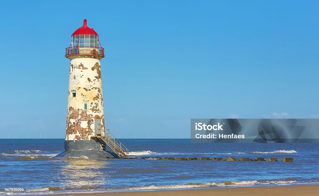 Derelict lighthouse on the edge of the coast. 2015 Stock Photo