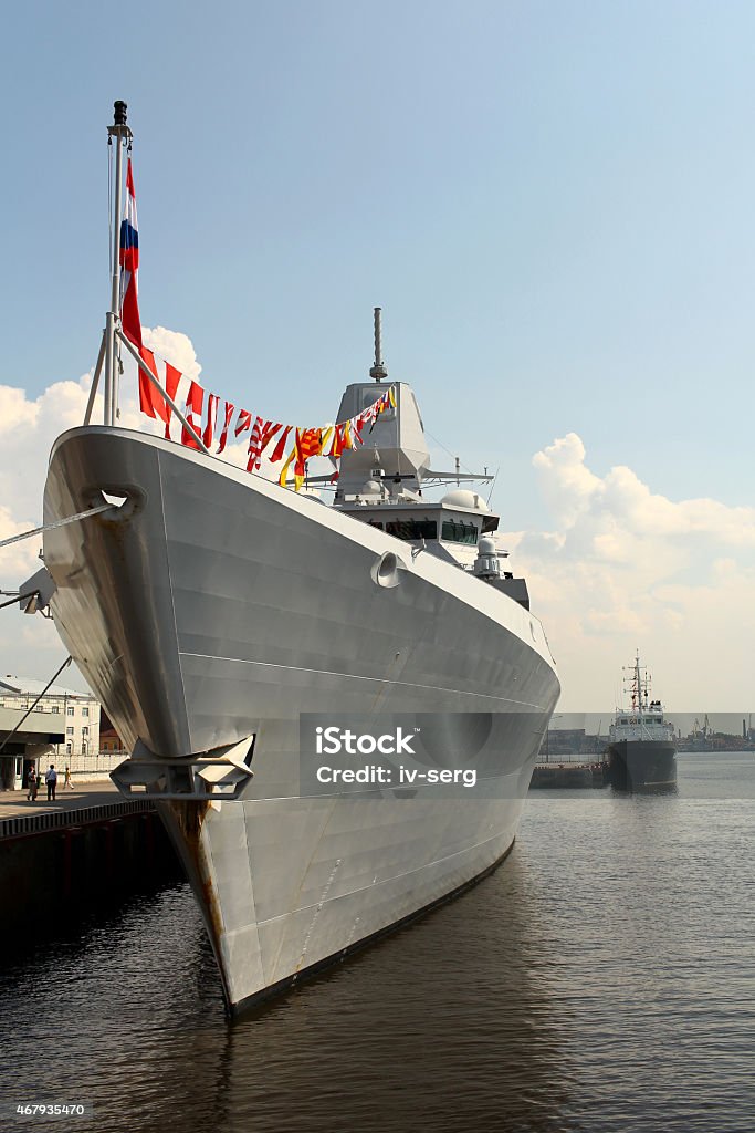 warship with flags at the pier Frigate at the pier in St. Petersburg Jule 5, 2013. Front View 2015 Stock Photo