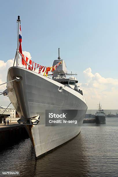 Warship With Flags At The Pier Stock Photo - Download Image Now - 2015, Armed Forces, Battleship