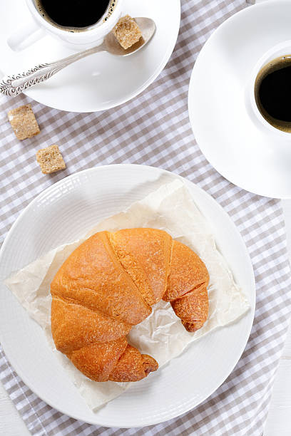 istock Fresh Croissants with coffee for breakfast 467935702
