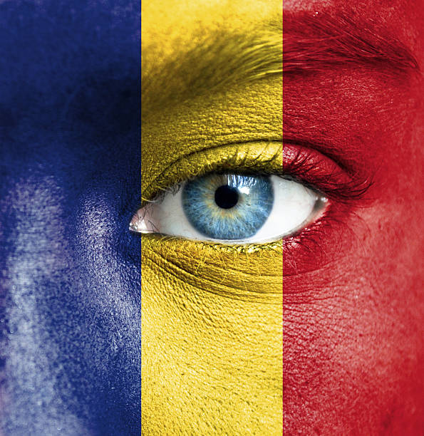 istock Human face painted with flag of Romania 467936113
