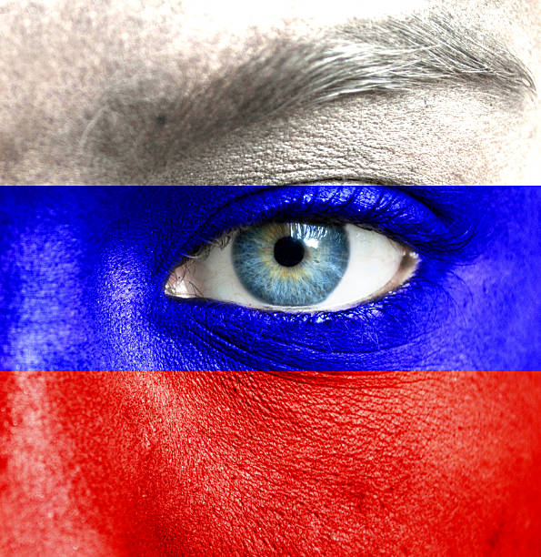 istock Human face painted with flag of Russia 467936129