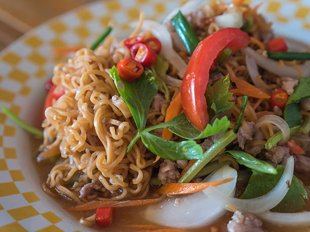 istock Yellow noodle spicy salad 467938516
