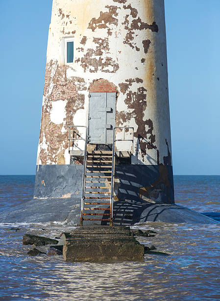 istock Derelict lighthouse on the edge of the coast. 467938614