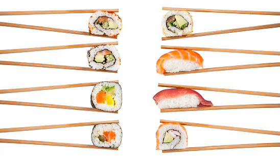 Delicious sushi, maki, nigiri pieces isolated on white background