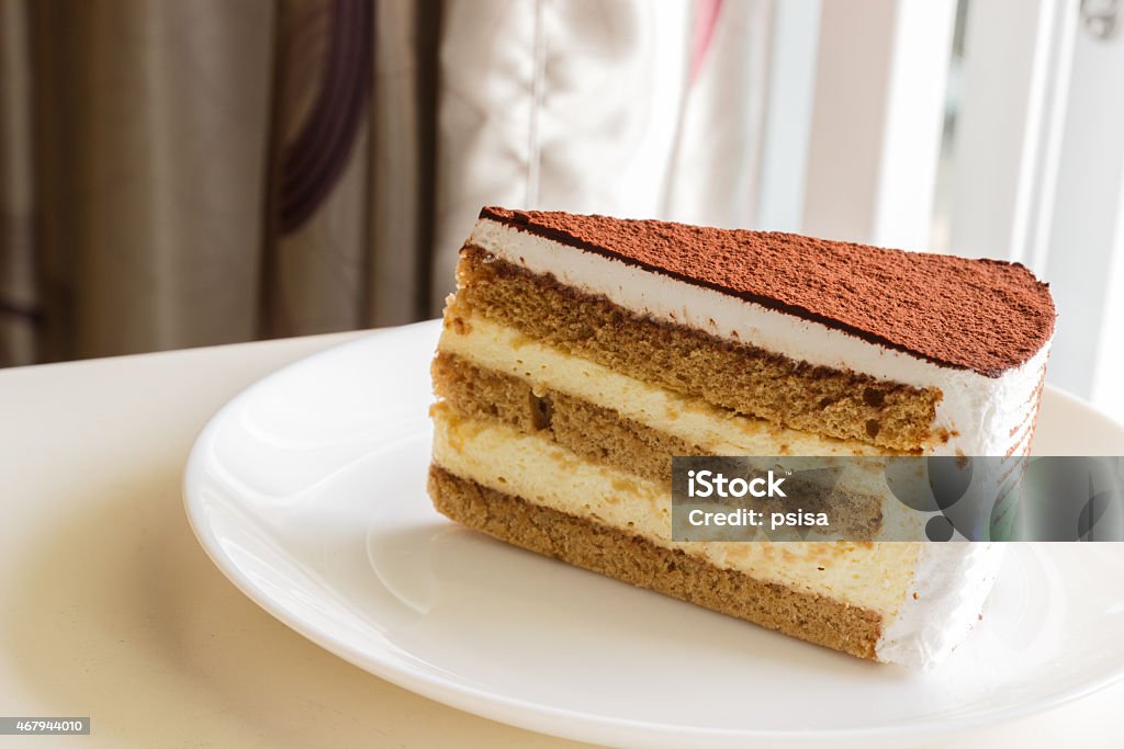 tiramisu topping with cocoa powder a piece of tiramisu topping with cocoa powder 2015 Stock Photo