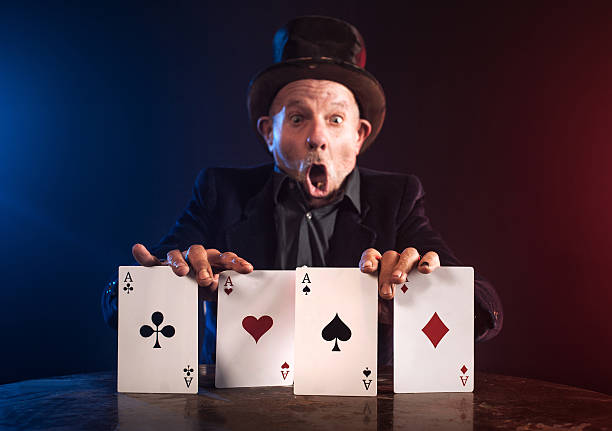 istock Senior man making trick with playing cards 467946982