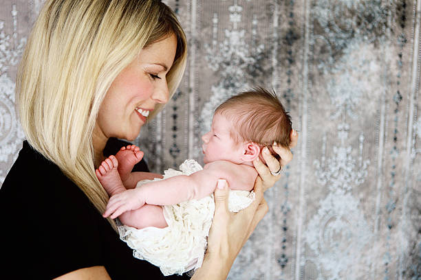 istock Mother and Newborn Daughter 467947842